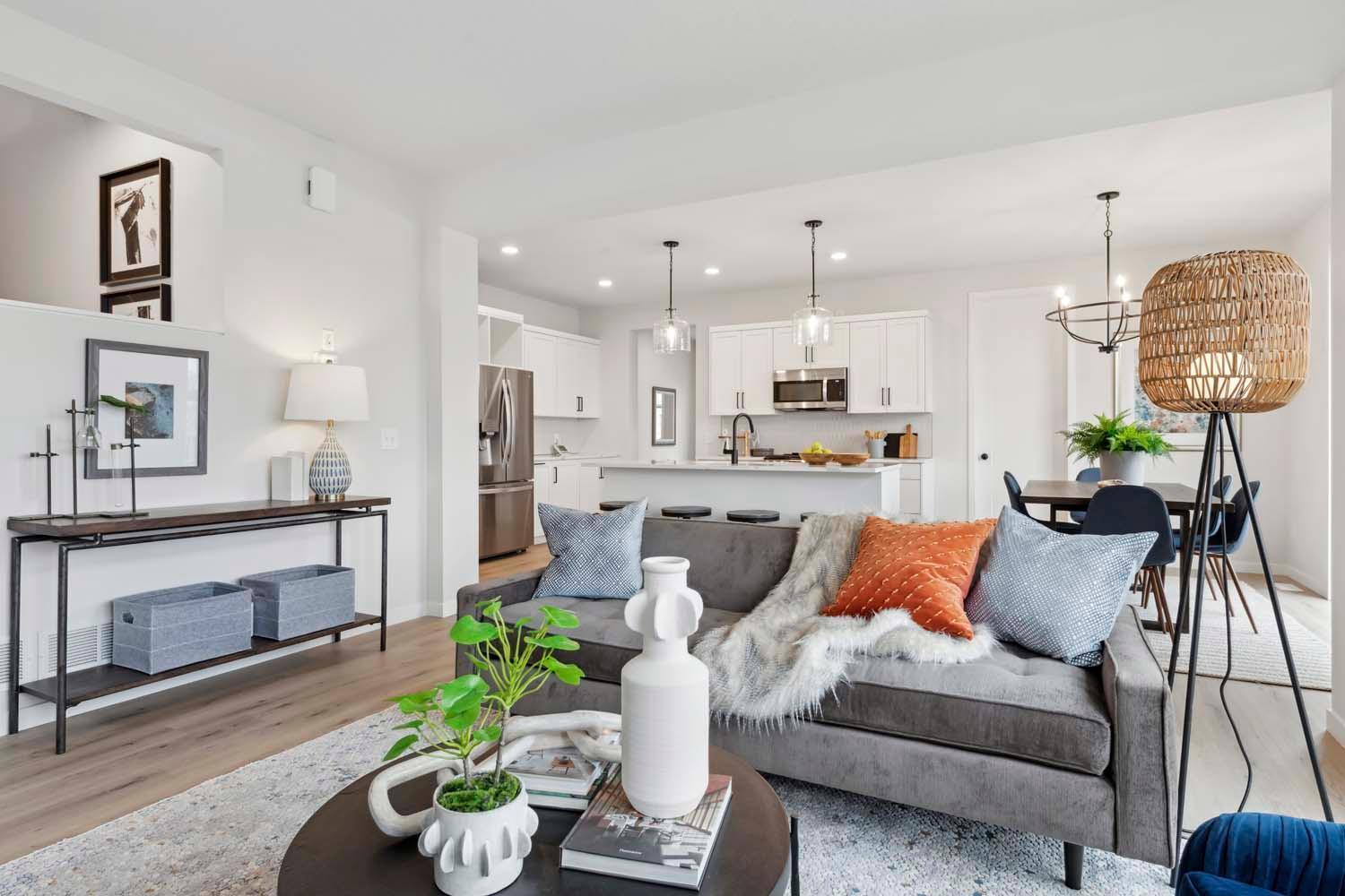 This beautiful new home features an open-concept family room and kitchen, creating a bright and spacious living area.