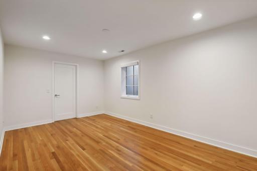 Large 4th bedroom in the lower level with a large egress window and huge walk-in closet. The walk-in closet was wired for a future sauna by the previous owner. Great extra bedroom or potential fitness room.