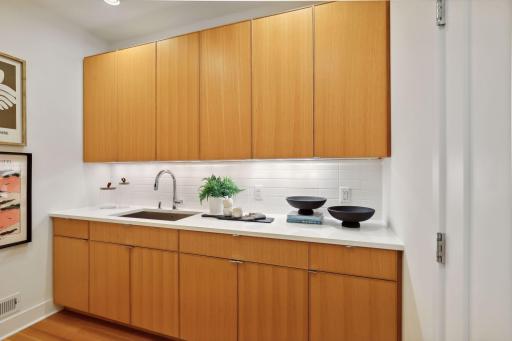 Main level wet bar and the enclosed laundry area provide excellent efficiency, flexibility, and convenience.