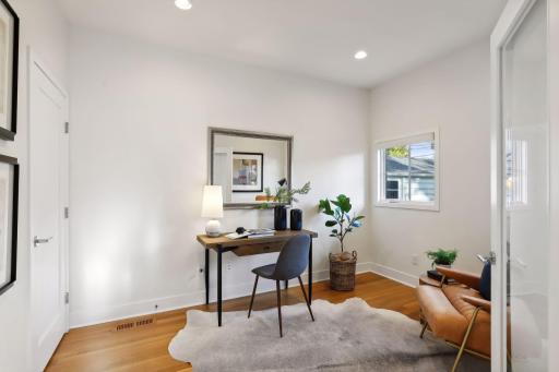 Main level office with french doors. The closet provides an option to use room as an extra main level (5th) bedroom, if needed. Not included in the bedroom count on MLS.
