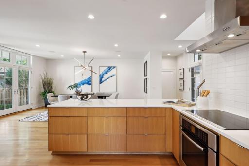 Open concept floor plan with great visibilty into the dining area and natural light pouring through patio windows and oors.