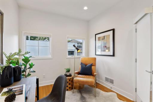 The main level office is tucked away down the hall from the main living areas and just opposite the patio entrance.