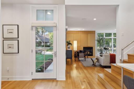 Gracious entry into the home with a nearby built-in bench and front hall closet.