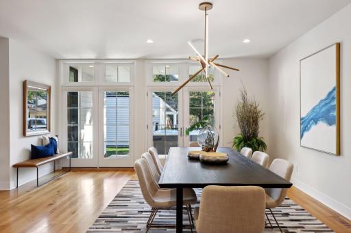 Spacious dining area with views to back yard and easy access to patio through french doors.