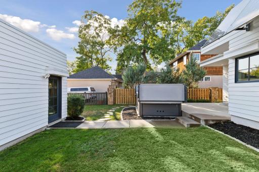 Covered entry to the large 2-car insulated heated garage.