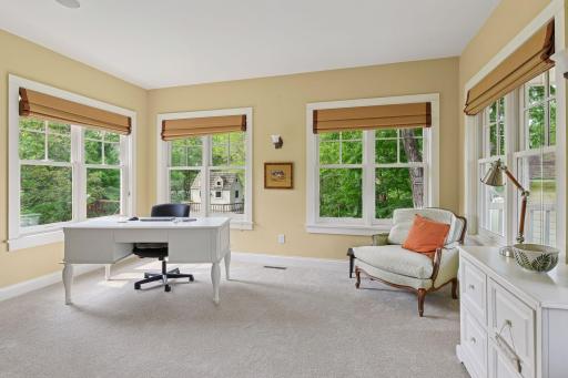 Main floor office surrounded by windows and abundance of natural light