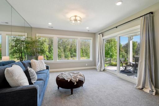 The second sunroom walks out to the private patio and enjoys beautiful views of nature