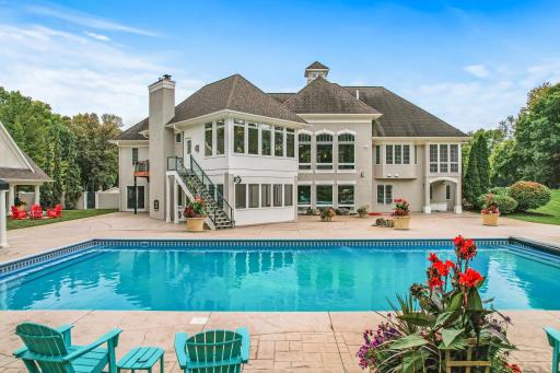 The landscaping has been meticulously re-finished, and the pool comes with a brand-new cover and new pumps. Two covered cabanas provide the perfect place to unwind on a hot summer day, offering shade and comfort by the poolside.