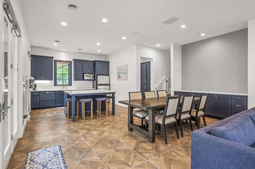 This space seamlessly connects with the kitchen and dining area, providing a perfect setup for gatherings.
