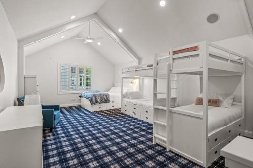 The upper level loft boasts a soaring 13-foot vaulted ceiling, offering endless possibilities for use.