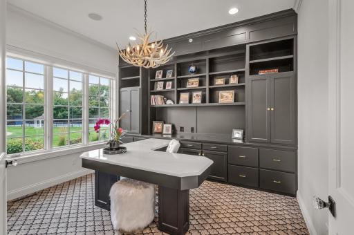 Whether for work or leisure, the study room exudes sophistication with its stunning black built-ins and an L-shaped quartz desk, creating an inspiring atmosphere for productivity.
