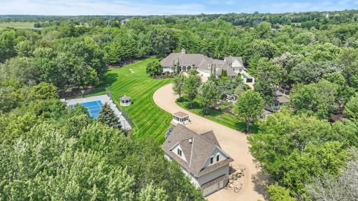 This exquisite property unfolds across a breathtaking 10 acres, accessible through a secure gate entrance. As you arrive, you're greeted by a picturesque pond and a mesmerizing waterfall, setting the tone for complete privacy and tranquility.