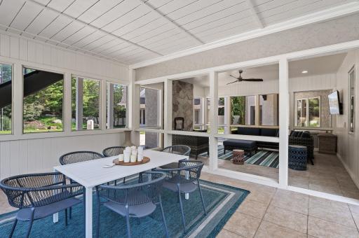 A screened jacuzzi room with an adjoining screened-in porch offers relaxation and rejuvenation opportunities.