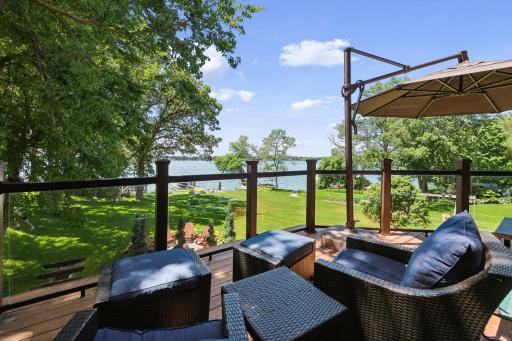 Connect with family and friends on the spacious Deck that overlooks the yard and lake.