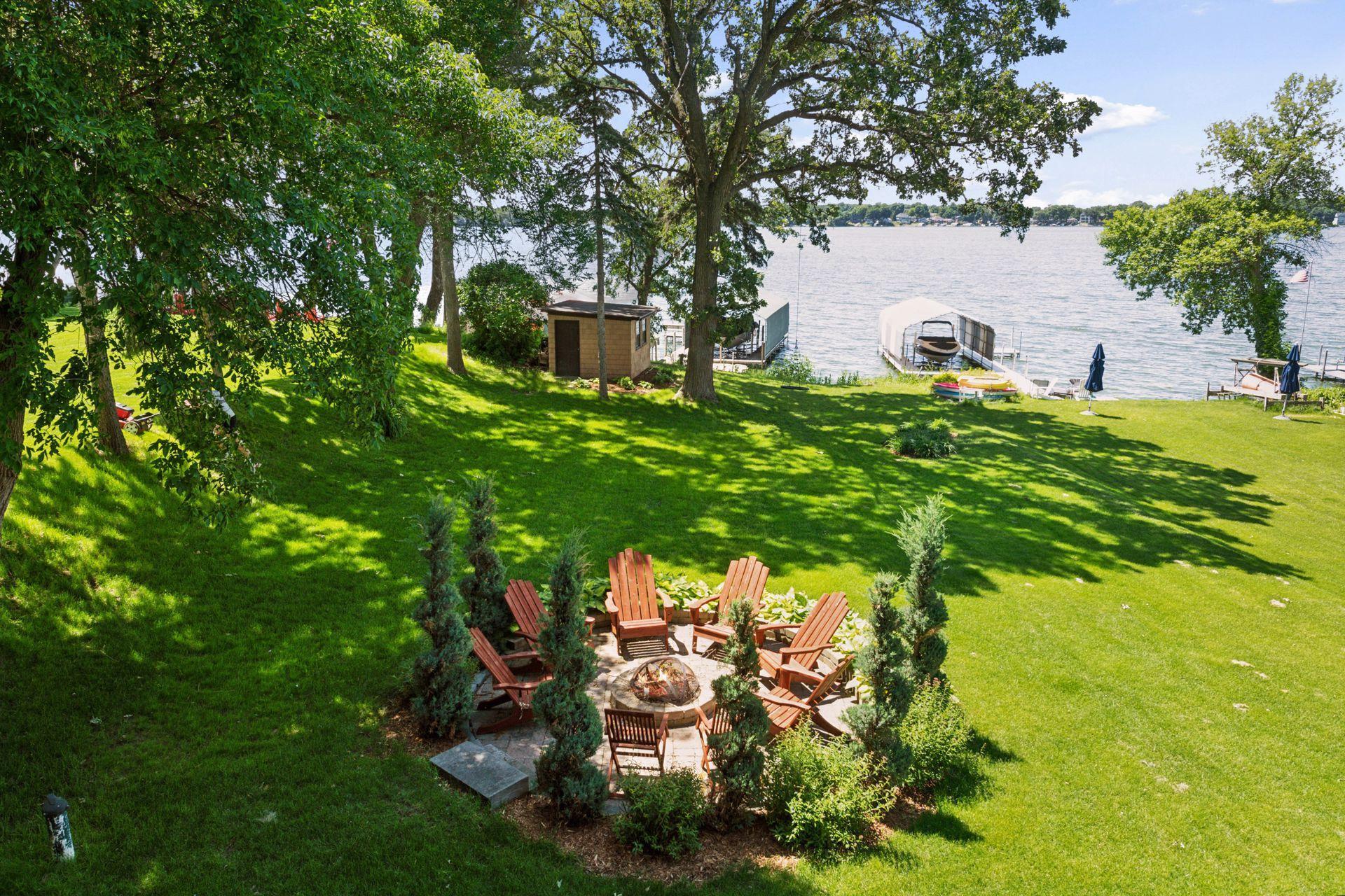 Beautifully landscaped and well-manicured, the large level lawn gently slopes to the shoreline.