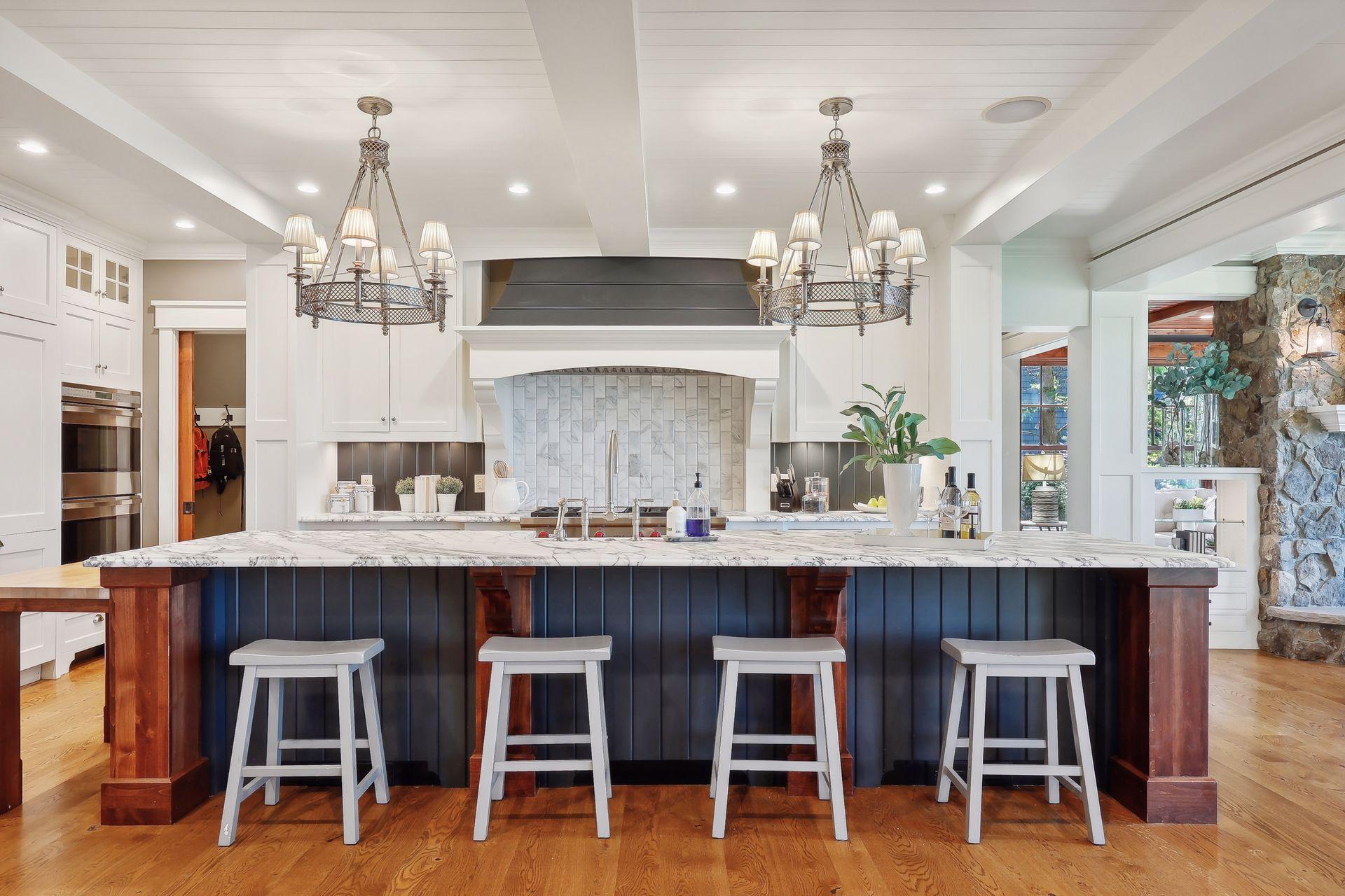 The gourmet Kitchen is the true heart of the home with masterfully crafted cabinetry topped with marble.