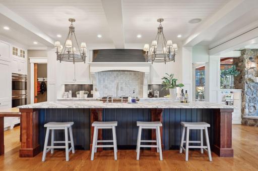 The gourmet Kitchen is the true heart of the home with masterfully crafted cabinetry topped with marble.
