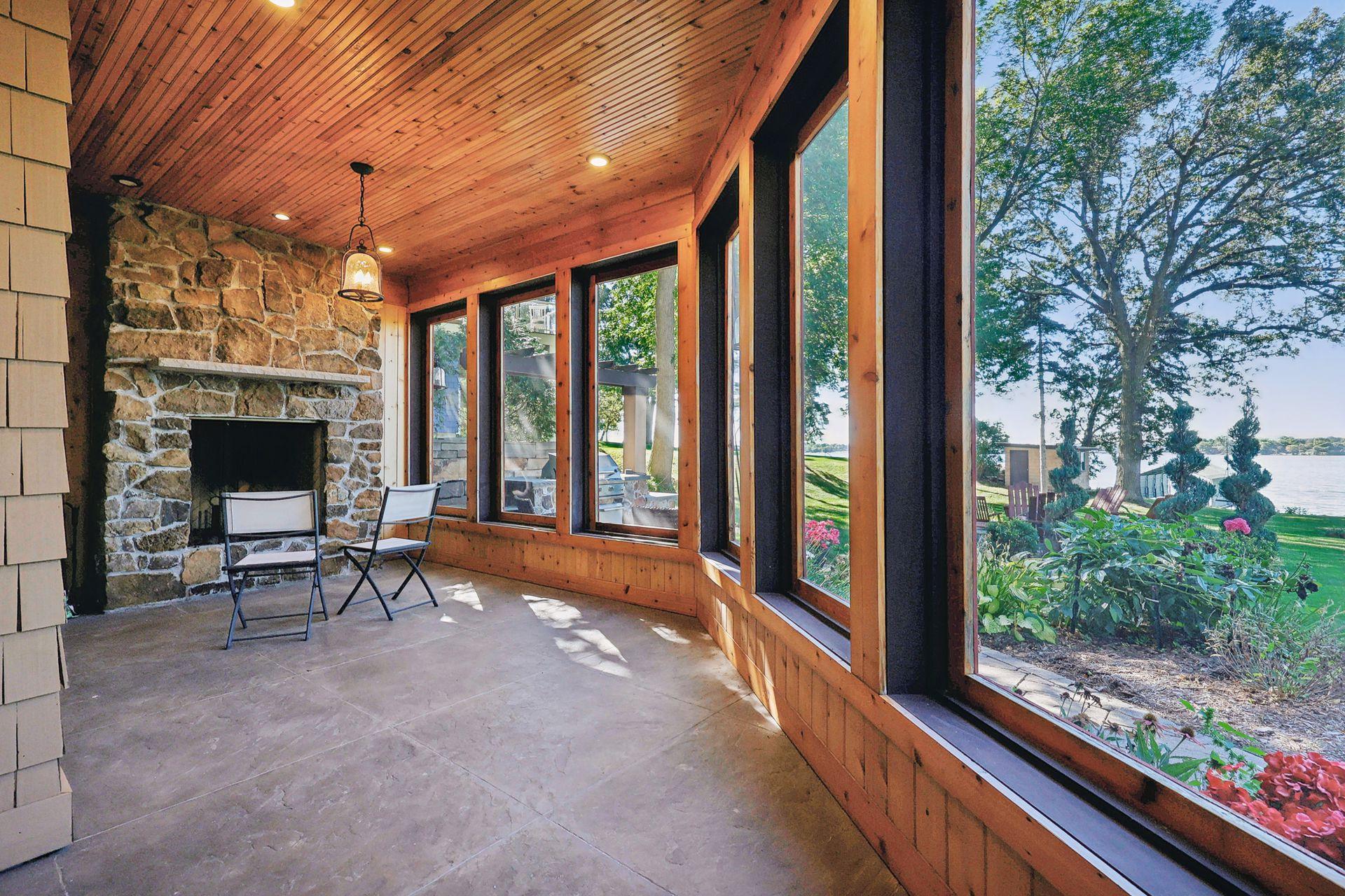 Just off the Billiard Room is the Screen Porch - light a fire in the wood burning fireplace and enjoy this peaceful setting.