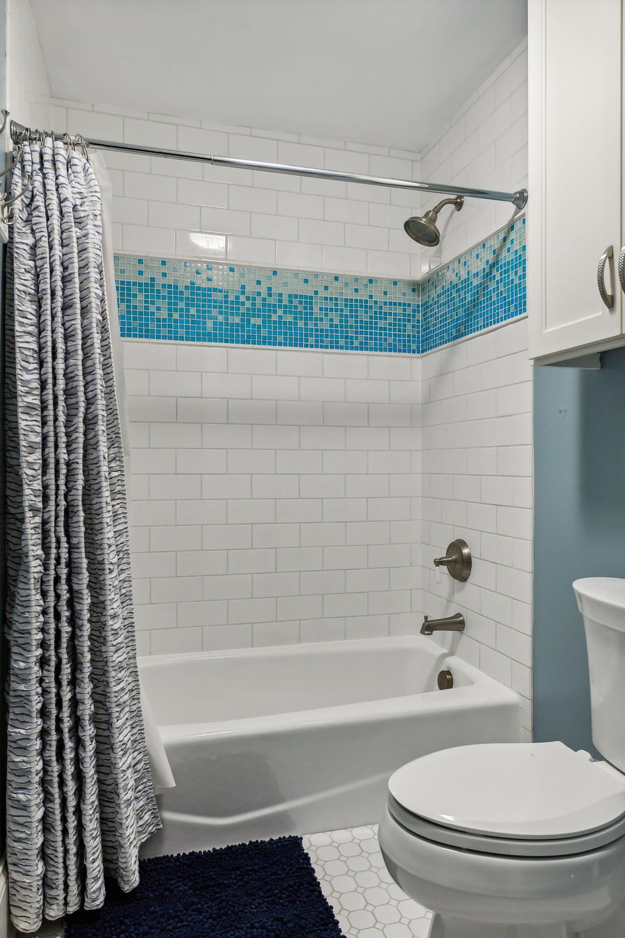 Subway tiled full bath