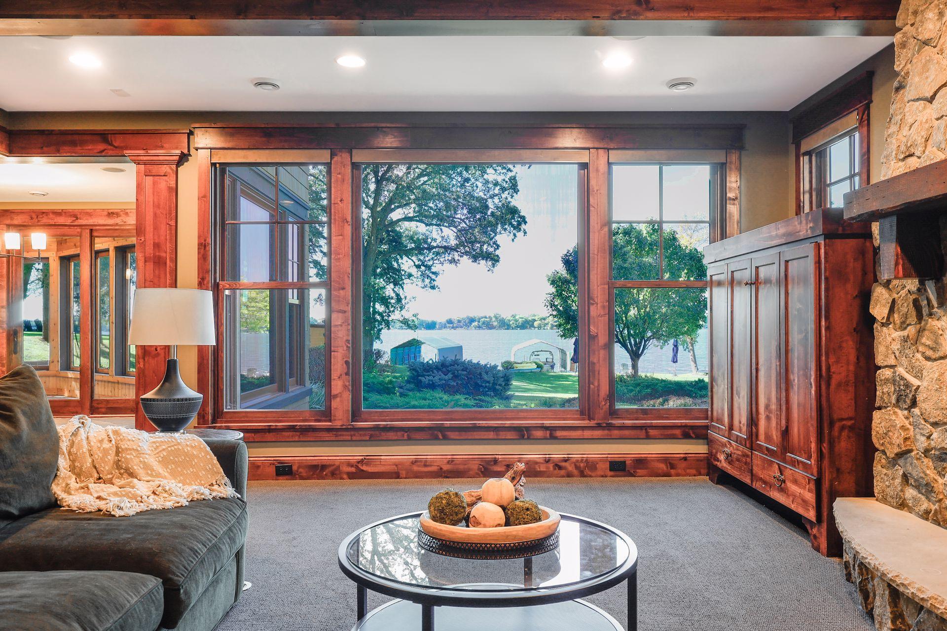 Large picture windows fill the space with natural light and provide commanding lake views.