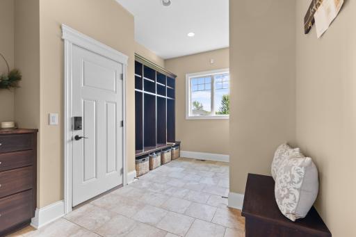 Large mudroom offers custom built-in locker perfect for coat & shoe storage