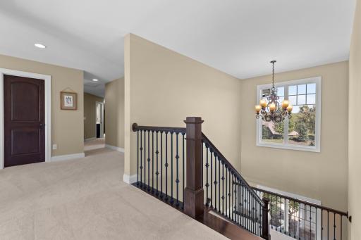 Ascend up the vaulted staircase to the upper level
