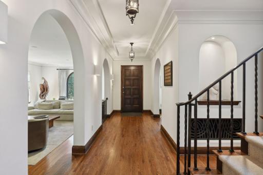 Step into this wonderful home through the large foyer with unique archways.