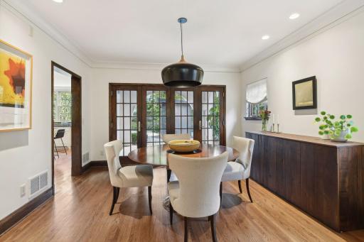 Formal dining room with French doors to covered outdoor patio area