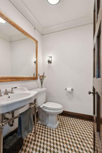 Main floor half bath with beautiful tiled floor