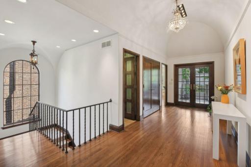 Very unique barrel ceiling in the second floor hallway with laundry and access to outdoor balcony/deck area
