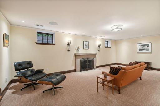 Lower level family room with fireplace, advised to make this into a gas fireplace
