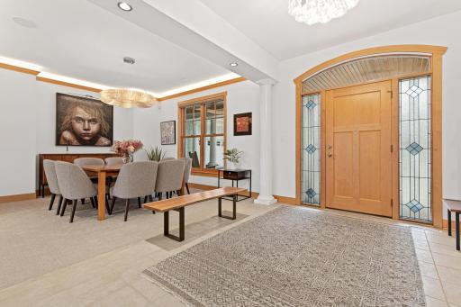 The generous sized entryway showcases a gorgeous wood front door with side lights and an arched transom that highlights the beautiful wood barrel vault ceiling on the front porch. A generous sized closet is found here too.
