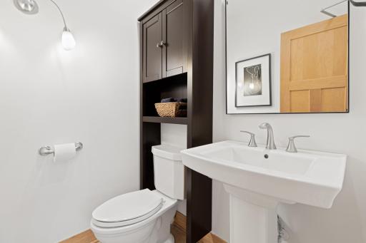 Main floor powder room has a self closing door!