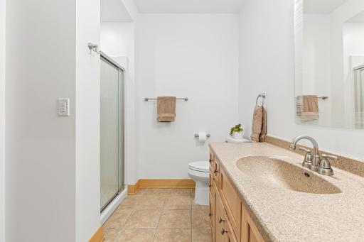 This 3/4 bathroom is attached to bedroom number 5 and is also accessible from the lower level family room.