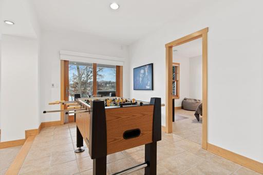 The lower level is a haven for entertaining both indoors and out! Between the theatre area, games area, custom-built walnut bar, and ample patio with a hot tub, there is something for everyone to love here! Bedrooms 5 and 6 are down here too.