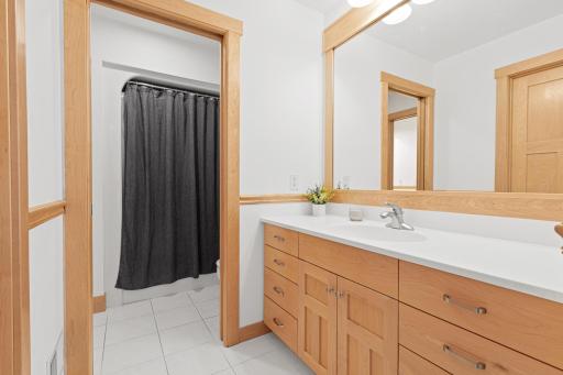View from the bedroom of the vanity area and the adjoining tub room/water closet that can be closed off with a pocket door.