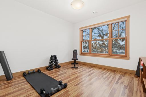 Bedroom 6 of 6 is located on the lower level and is currently used as a workout area. It has an attached 3/4 bathroom.