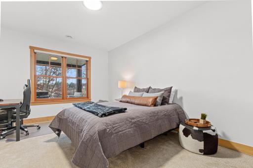 Bedroom 5 of 6 is one of the two bedrooms located on the walk out lower level. This room also has views to the lake.
