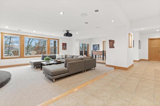 The lower level has in-floor heat and walks out to a large patio with ample room for outdoor seating and a hot tub.