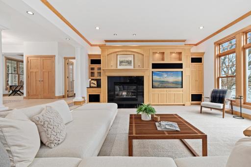 The south facing living room has gorgeous views of the lake and ample natural sunlight by day, but it becomes a cozy hang out space in the evening while gathered around the fireplace. The smart lighting throughout the home is fully customizable.