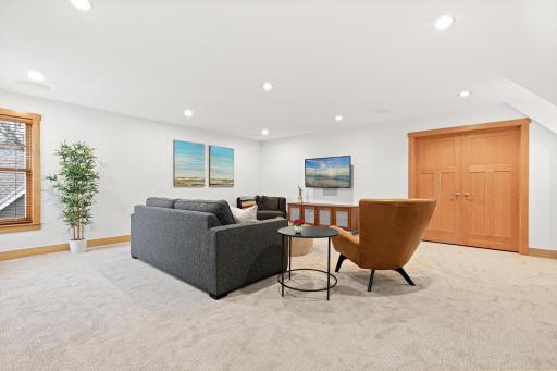 Alternate view of the upper level games/family room with double doors to the bonus room which could also function as a 7th bedroom, hobby space, playroom, exercise room, and more!