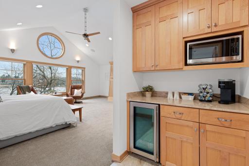 The dry bar is located between the bedroom and the bathroom. There is no need to head to the kitchen for your favorite morning or evening beverage when you can store them right here!