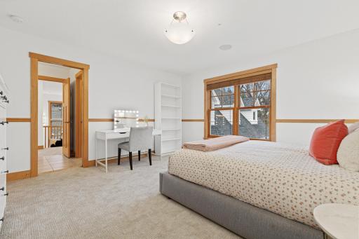 Alternate view of the bedroom shows the attached walk-through bathroom. The bedroom can be closed off by a pocket door.