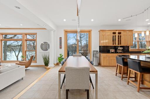 The thoughtful layout of the home, and generously sized Marvin windows and doors, highlight the sweeping views of the lake and the beauty of the home's serene setting.