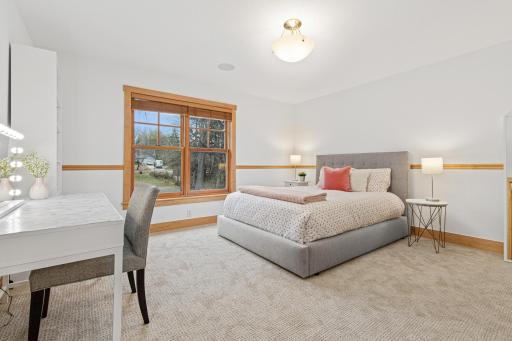 Bedroom 2 of 4 on the upper level features double windows, new carpet and an oversized walk in closet.