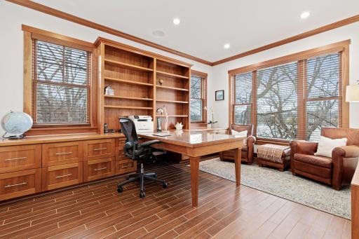 This stunning office has gorgeous built-in's with amazing storage, crown molding, in-ceiling speakers and fabulous views of the lake. The office is situated near the front door and is a professional space that is suitable to host in-home meetings.