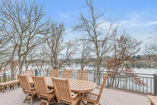 This lovely deck with southern exposure is sure to be a favorite dining spot in the summer. A motorized retractable awning provides shade when needed. The deck is just 1 of the 5 outdoor living areas.