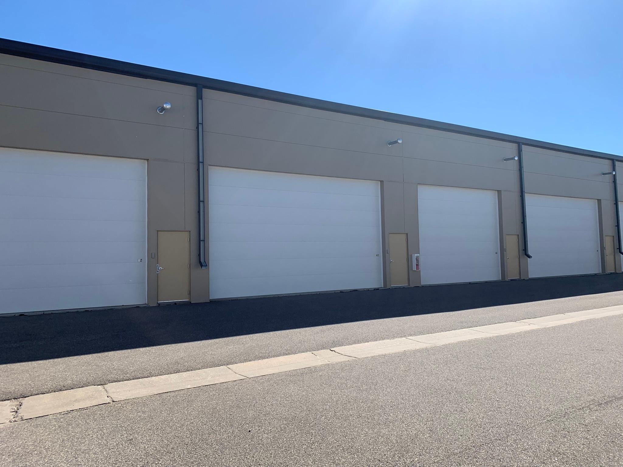2 - 24' X 16' Overhead door and walk through door access.JPEG