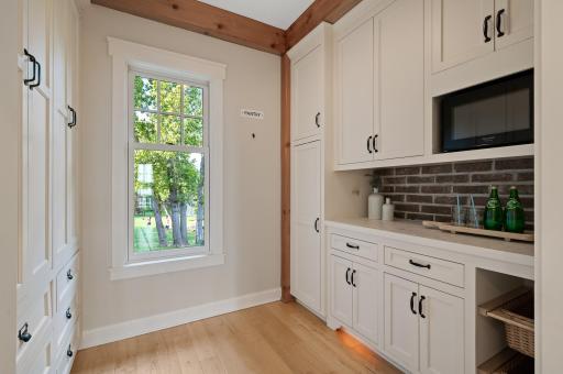 Large walk-in pantry with abundance of storage.