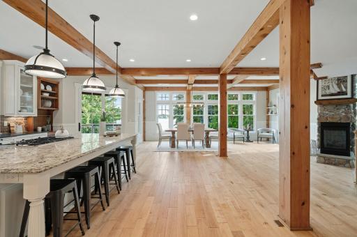 The stunning grand entry welcomes you with wood post and beam construction, rich wainscoting, surround sound and in-floor heat that extend throughout the home.
